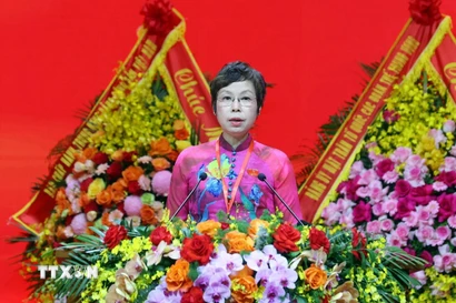 Đồng chí Vũ Việt Trang, Ủy viên Ban Chấp hành Đảng ủy Chính phủ, Bí thư Đảng ủy, Tổng Giám đốc Thông tấn xã Việt Nam trình bày dự thảo Nghị quyết Đại hội. (Ảnh: Phạm Kiên/TTXVN)