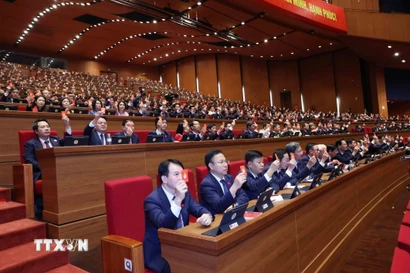 Đại biểu biểu quyết tại Đại hội. (Ảnh: TTXVN)