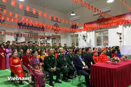 Các đại biểu dự lễ khai mạc bầu cử tại Khu vực bỏ phiếu số 1, phường Vĩnh Hưng, Hà Nội. (Ảnh: Thu Hương/Vietnam+)