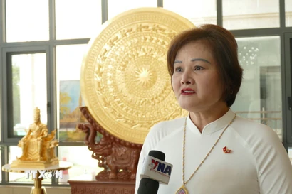 Bà Phạm Thị Minh Hường, Chủ tịch Hội đồng quản trị kiêm Tổng Giám đốc Công ty Gold Phuc, Ủy viên Ban Thường vụ Tổng hội người Việt Nam tại Lào, Phó Chủ tịch Hiệp hội Doanh nhân Việt Nam ở nước ngoài, bày tỏ niềm tin vào những thành tựu mà Việt Nam đã đạt được trong nhiệm kỳ vừa qua. (Ảnh: Xuân Tú/TTXVN)