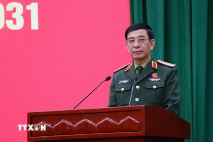 Đại tướng Phan Văn Giang, Bộ trưởng Quốc phòng, trình bày chương trình hành động. (Ảnh: Trần Trang/TTXVN)