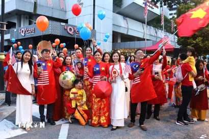 Người Việt trong hoạt động kỷ niệm 80 năm Quốc khánh Việt Nam tại thủ đô Kuala Lumpur, Malaysia. (Ảnh: PV/TTXVN)